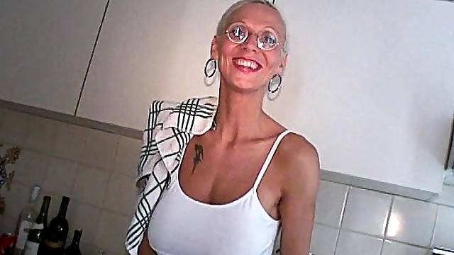 Blonde mature Melizza More with glasses takes a fat cock in her mouth