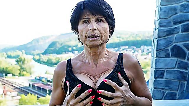 Big-boobed brunette Petra T nicely plays with her shaved pussy