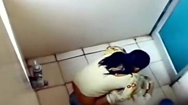 Indian coed girls get caught on tape using the university toilet