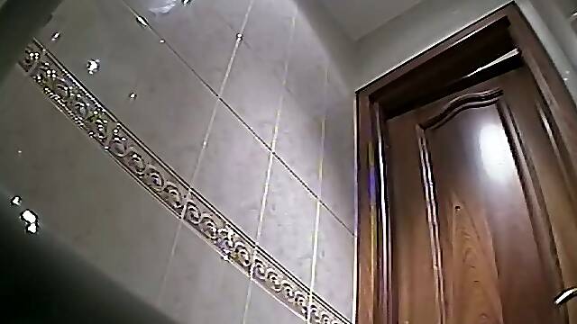 Blonde white milf in the toilet room shows her ass on hidden cam