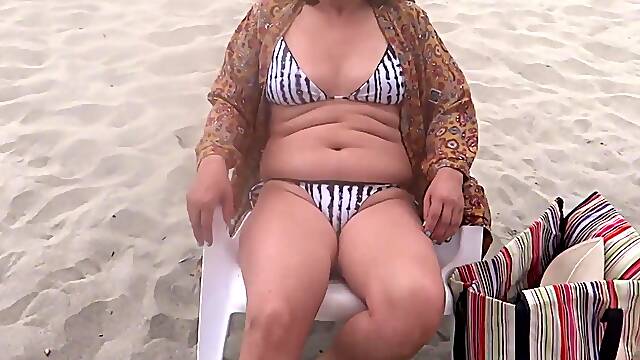 On the beach, my stepson wants to fuck me and cums in my pussy with his big dick.
