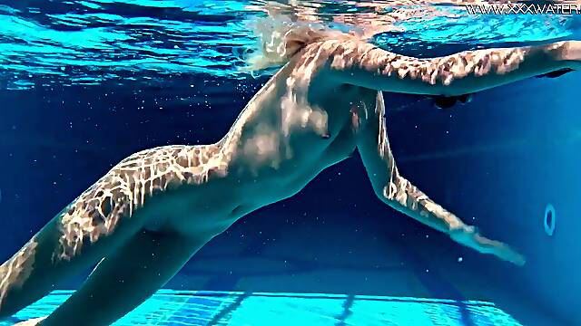 Very fit Russian babe Mary Kalisy shows off her hot body in a nude swim