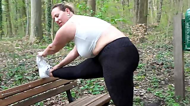 Chubby German milf having an outdoor blowjob in the woods with a stranger man