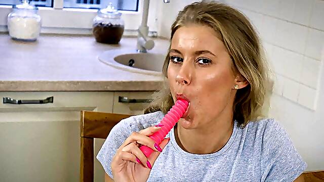 Trimmed temptress Eyla teases with slick solos on a table