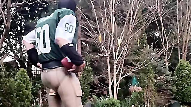 Football jock working out, plugged