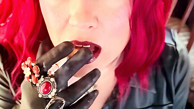 Your Mistress Tina Snua dressed In Leather Chain Smoking 2 Cork Cigarettes