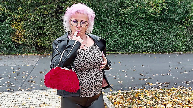 Naughty Granny Tongue Out Flashing Big Tits in Public